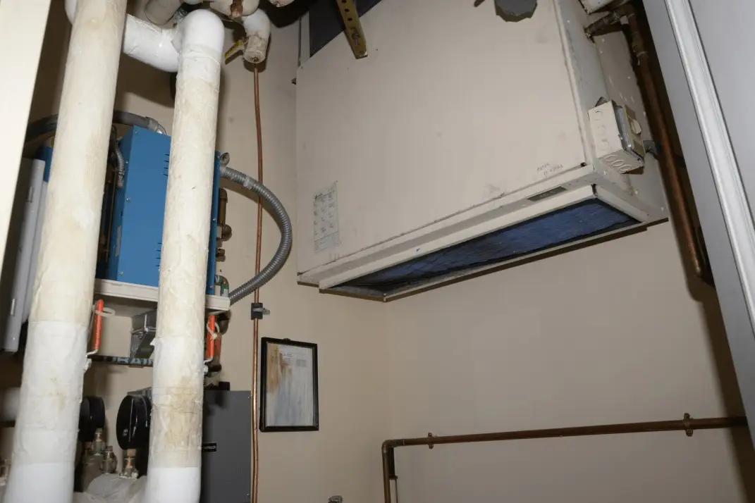 Mechanical room with boiler and heating pipes