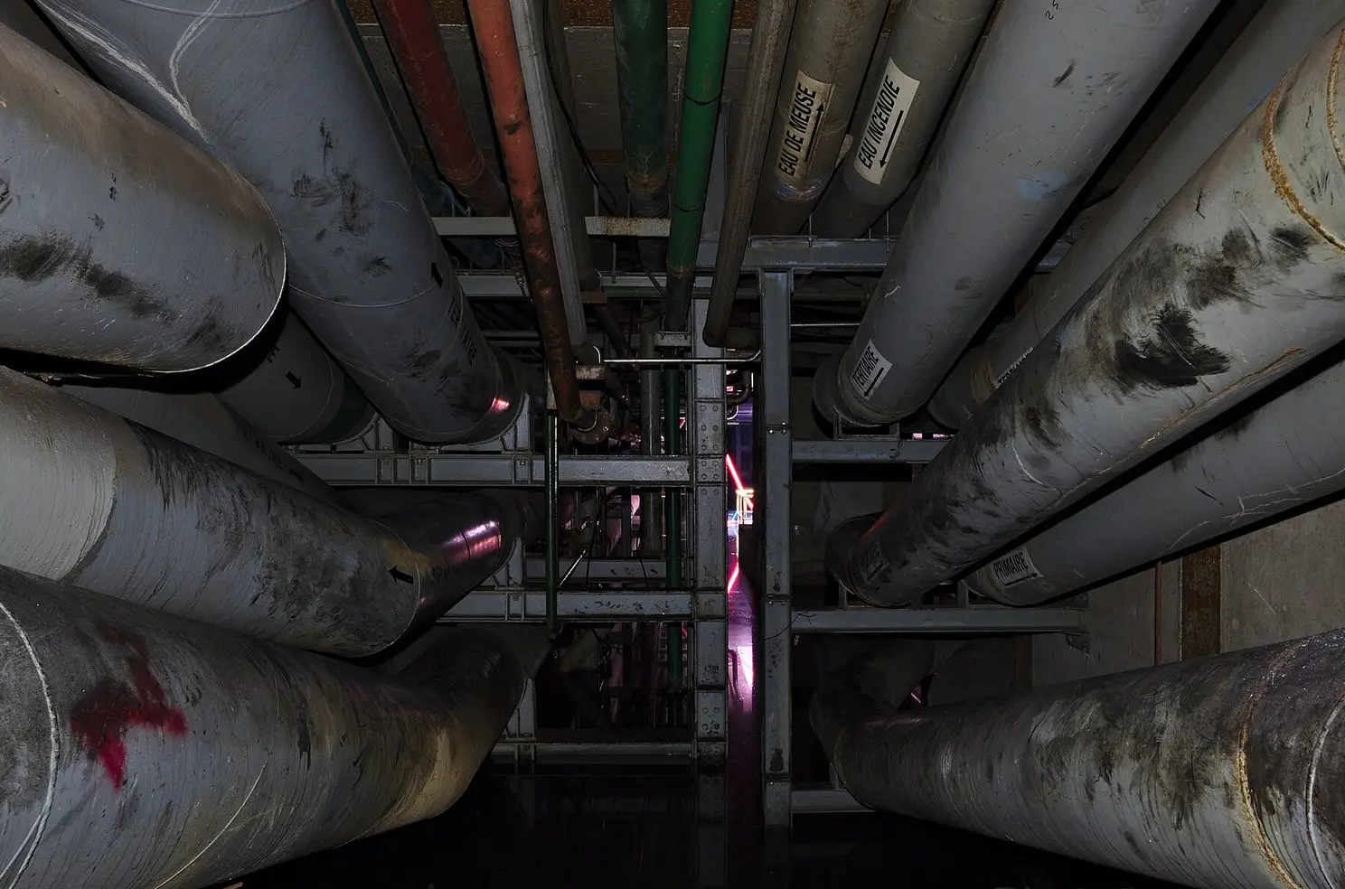 Metal water pipes along a building wall