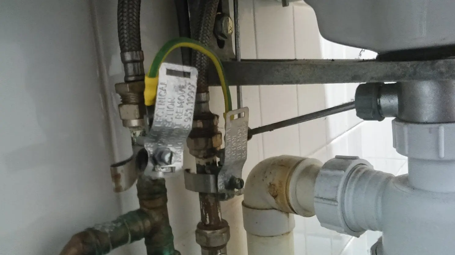 Licensed plumber working on a residential repair